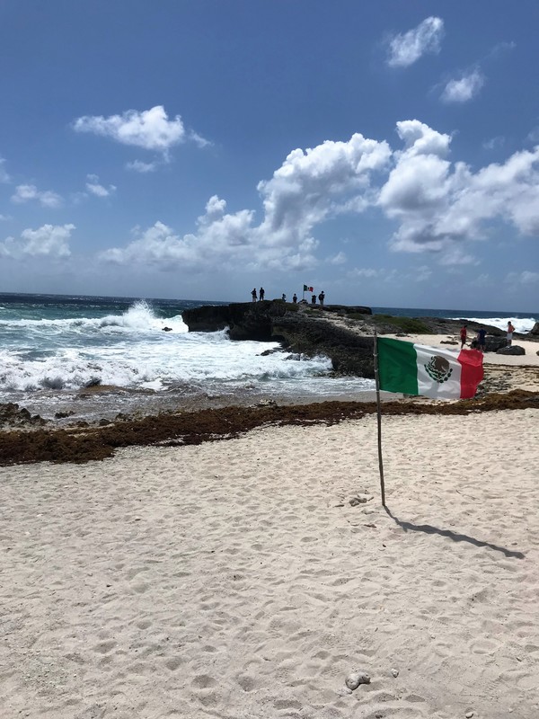 Mexican flag on beach